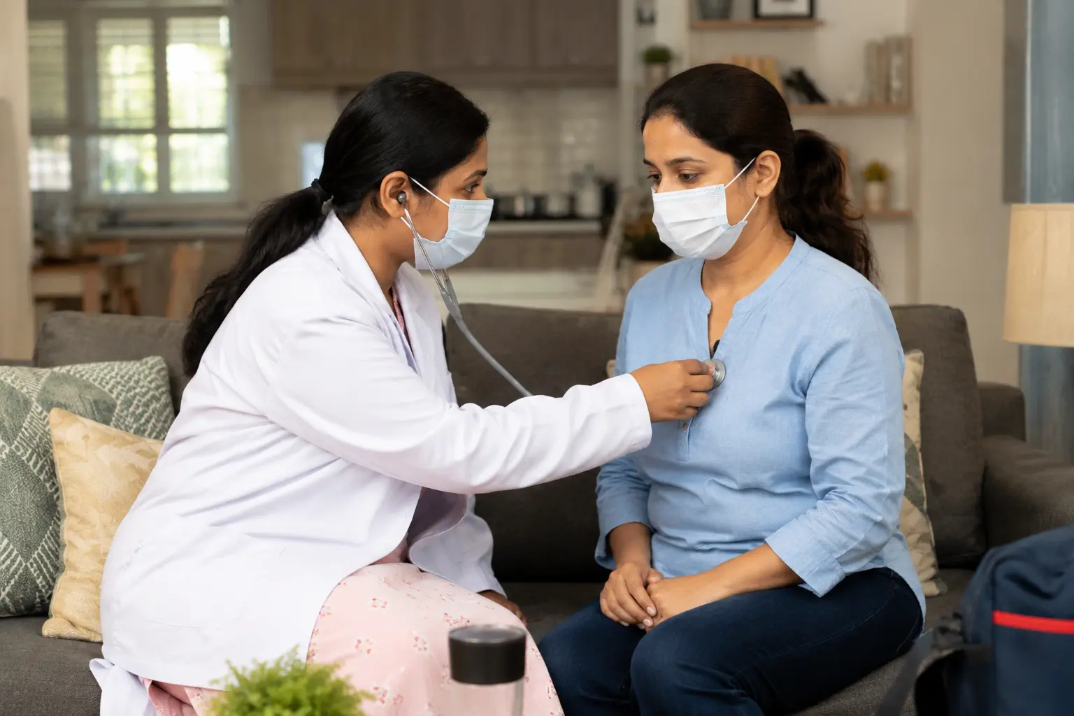 Verified doctor performing checkup at patient's home